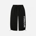 Black jogger-style pants with an elastic waistband, drawstring ankle cuffs, and vertical white 'ETERNALFAIRE' text printed on the left leg, shown against a plain light gray background.